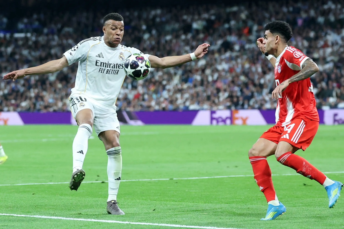 Kylian Mbappé battles Dayot Upamecano during the UEFA Champions League quarter-final first leg between Real Madrid and Bayern Munich at the Santiago Bernabéu on April 7, 2026, ahead of the decisive second leg at the Allianz Arena
